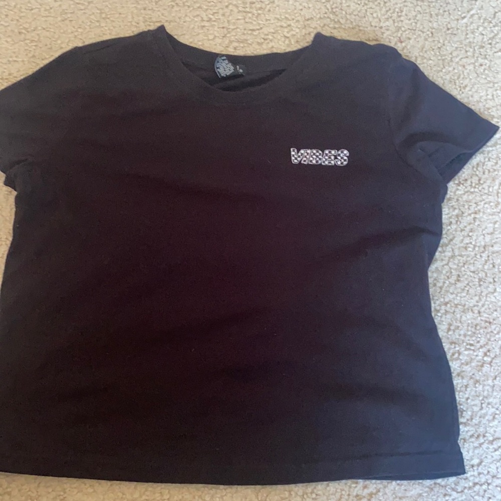 black shirt with words on it from the 21